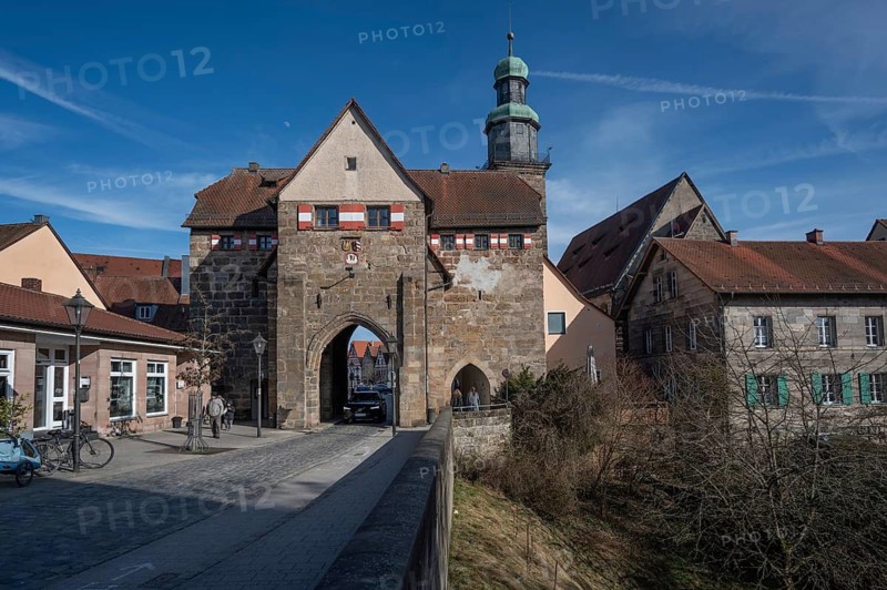 Historic Nuremberg Gate, built in 1526, tower of St. John's Church in the back, Lauf an der Pegnitz, Middle Franconia, Bavaria, Germany