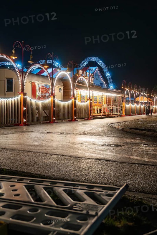Illuminated circus at night with blue and white arches creating a calm atmosphere, Böblingen, Germany