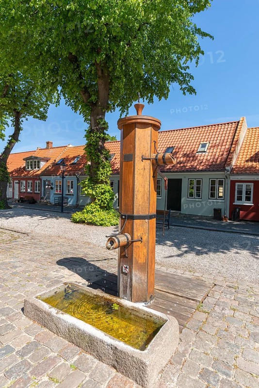 Bogense on the Kattegat, old town with colourful eaves houses, Marktpkatz, historical historic water fountain, hand pump, cobblestones, Fyn, island of Funen, Baltic Sea, Denmark