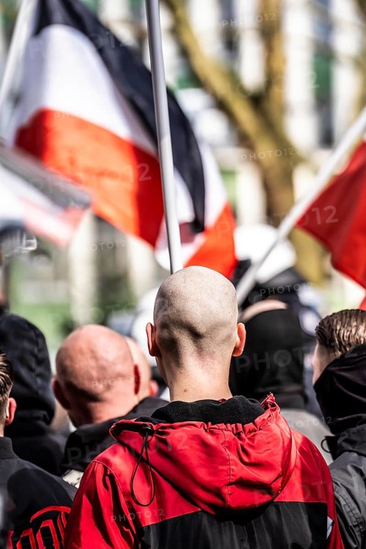 The neo-Nazi group Jung und Stark, JS, demonstrates in the city centre of Essen, demanding the remigration of foreigners, chanting Deutschland den Deutschen Ausländer raus, approx. 150 ultra right-wingers, dressed in black and wearing typical scene clothing, several groups demonstrate against the Nazi march, Essen, North Rhine-Westphalia, Germany