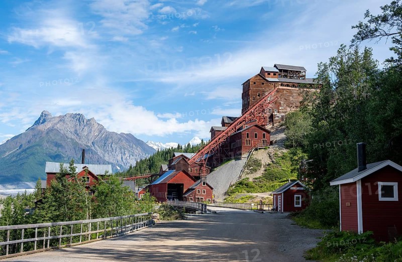 Red Kennicott buildings in front of mountainous landscape, Kennicott Concentration Mill to extract copper from quarried rock, Historic Kennecott Copper Mine, National Historic Landmark, Wrangell St. Elias National Park, Alaska, USA