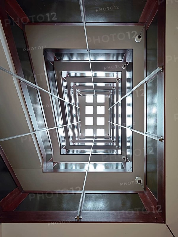 Stairwell in a high-rise building, looking vertically upwards