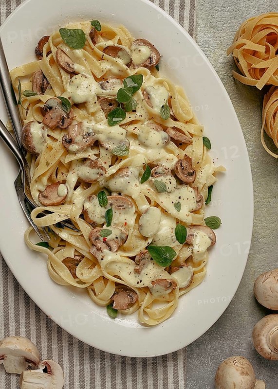 Fettuccine with champignons, basil, in cream sauce, homemade, no people
