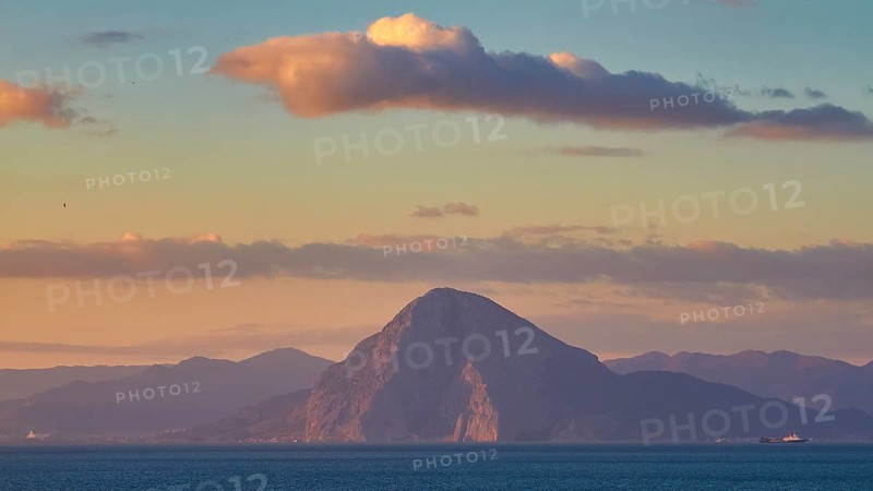 A majestic mountain rises from the sea under cloudy sky, New ferry port in southern Patras, Ferries, Patras, Peloponnese, Greece