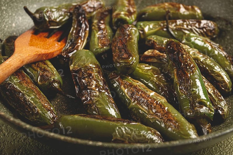 Fried padron pepper, in a frying pan, with olive oil, and sea salt, homemade, no people