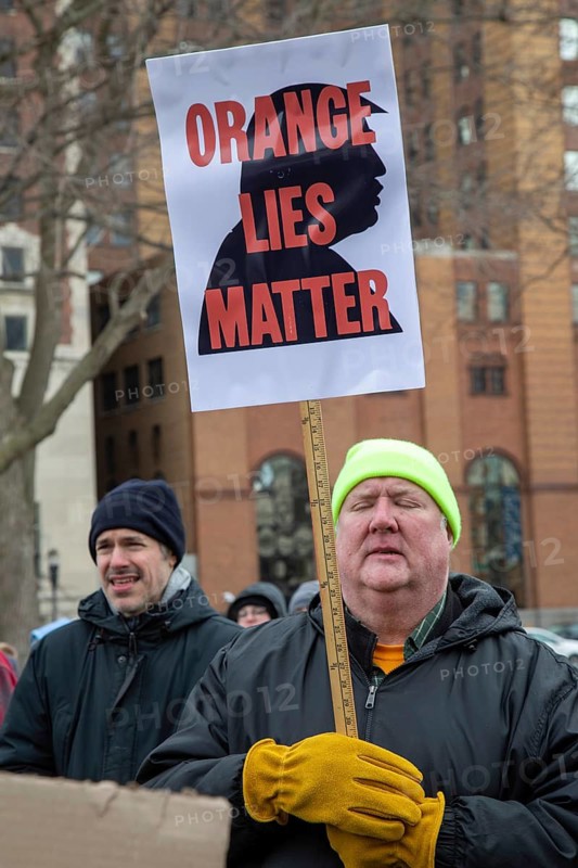 Lansing, Michigan USA - 5 February 2025 - People rally at the Michigan state capitol to oppose President Trump, Elon Musk, and Project 2025. Similar rallies were planned across the country, many of them at state capitols