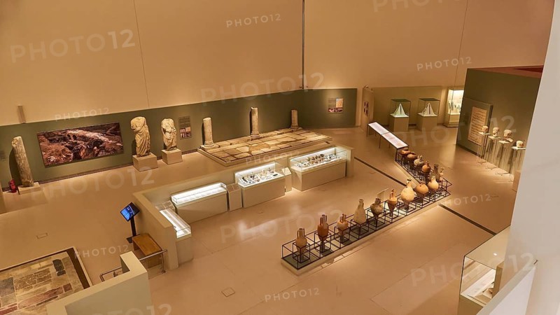 Modern exhibition room in the museum with sculptures and artifacts under lighting, Patras Archaeological Museum, Patras, Peloponnese, Greece
