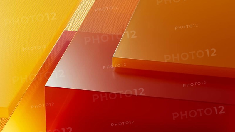 An arrangement of transparent crystals showcases a harmonious blend of warm colors, creating a striking visual effect in an abstract design