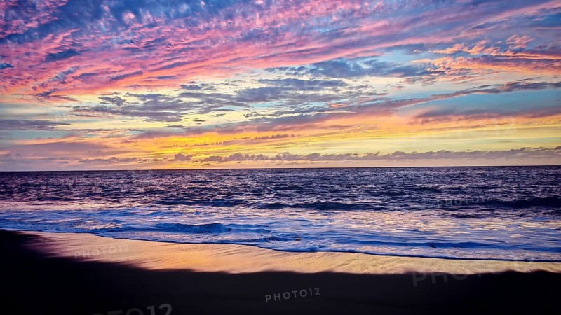 Purple-pink ocean cloudscape at sunset with soft waves, romantic, Tarrafal de Monte Trigo, Santo Antao, Cabo Verde, Cape Verde, Cape Verde