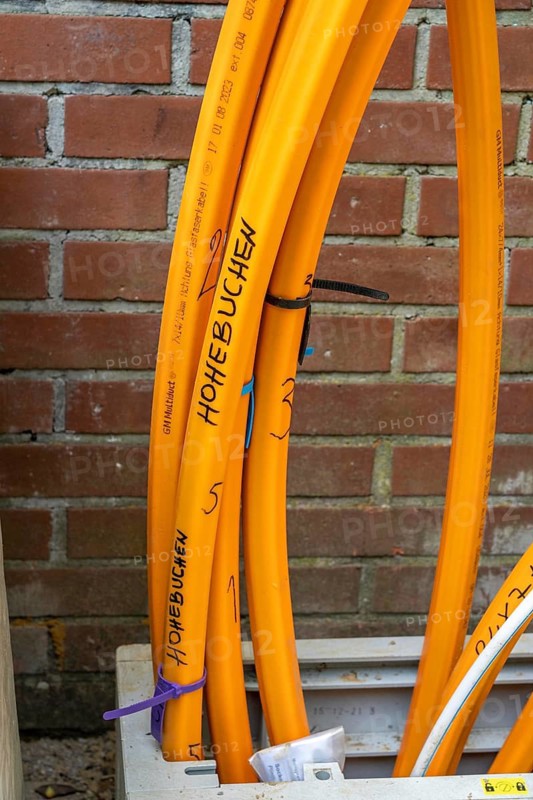 Distribution box in which empty conduits for fibre optic cables arrive and are connected, in which the actual fibre optic cable is later blown in and connected to the respective house connection. Essen, North Rhine-Westphalia, Germany