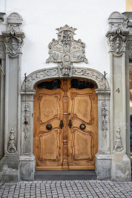 Magnificent wood-carved baroque door with decorative stone figures and intricate ornament in the historic old town of Constance, traditional craftsmanship, district of Constance, Baden-Württemberg, Germany