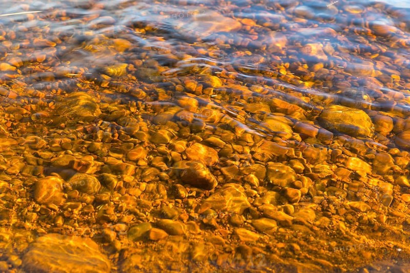 Small stones in the riverbed of Österdalälven River, Älvdalen, Dalarnas län, Sweden