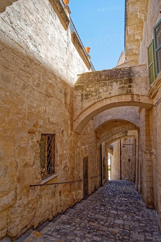 Paths and corridors in the tuff of the Sassi Barisano in the cave town of Matera. The cave settlements, Sassi, are a UNESCO World Heritage Site. Matera, Basilicata, Southern Italy, Southern Europe