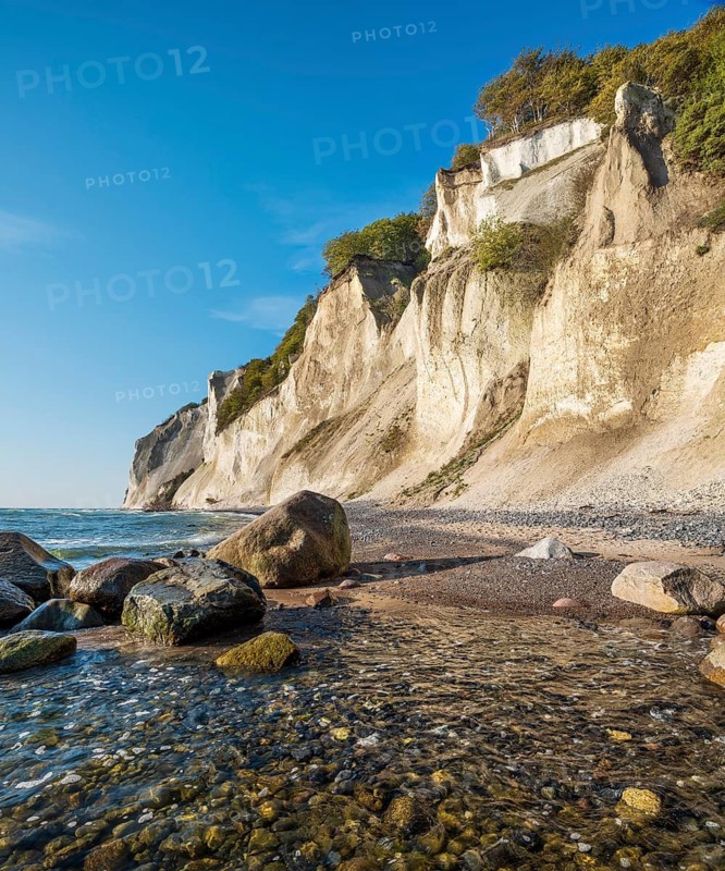 Beach with boulders at the chalk cliffs of Møns Klint on the Baltic Sea, Møn Island, Denmark