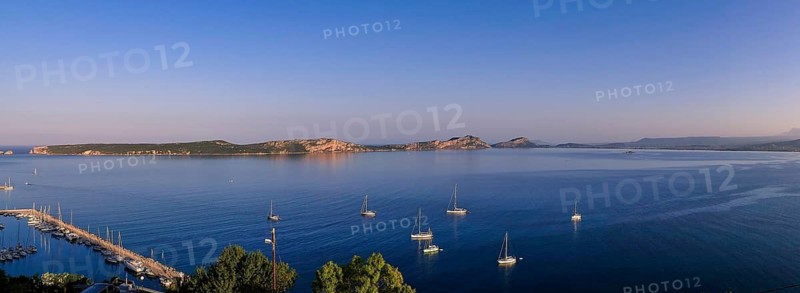Several sailboats float on a wide, calm lake in soft morning light, Navarino Bay, Pylos, Peloponnese, Greece