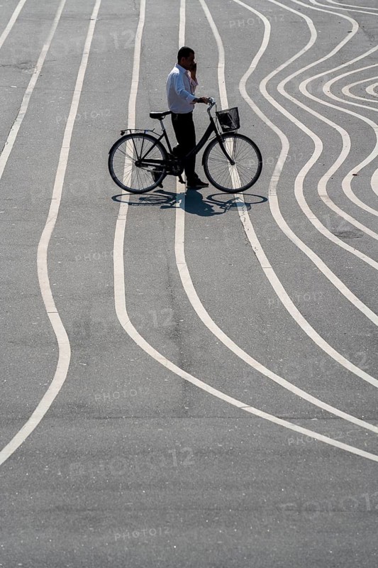 The Nørrebro district in Copenhagen, lively, multicultural and student neighbourhood, Superkilen Park, Den Sorte Plads, square designed with white lines, playgrounds, cultural facilities, sports equipment, cycle path, Denmark