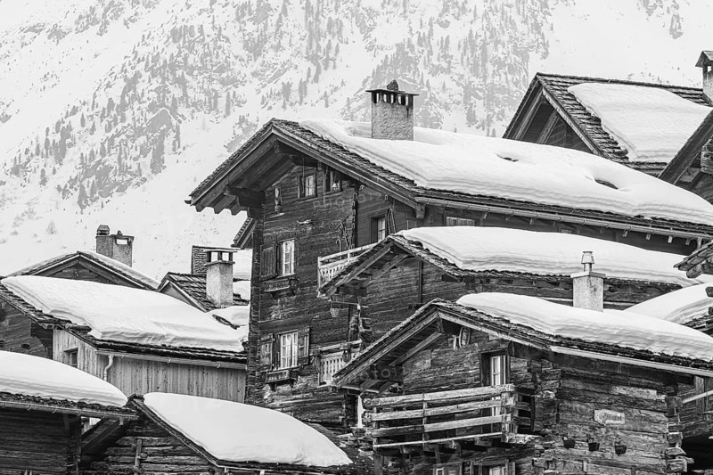 Snow-covered old farmhouses, black and white photo, historic town center, Grimentz, Val d'Anniviers, Valais Alps, Canton of Valais, Switzerland