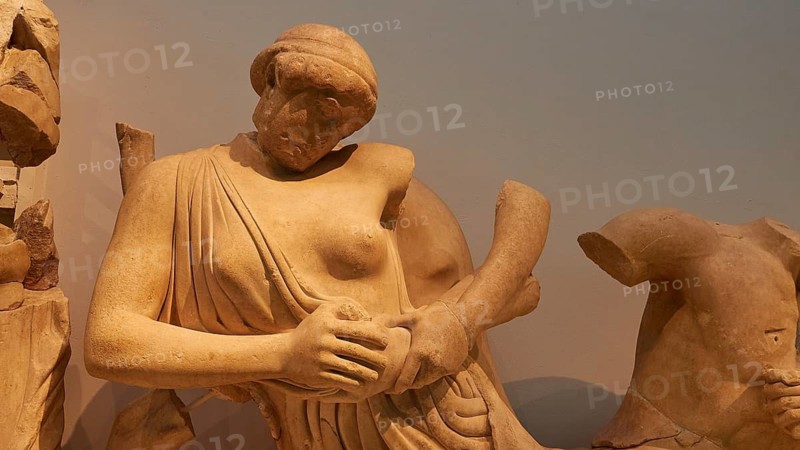 West gable of the temple of Zeus, battle between lapiths and centaurs, ancient marble sculpture of a classic female figure, partly damaged, Olympia Archaeological Museum, Ancient Olympia, Olympia, Peloponnese, Greece