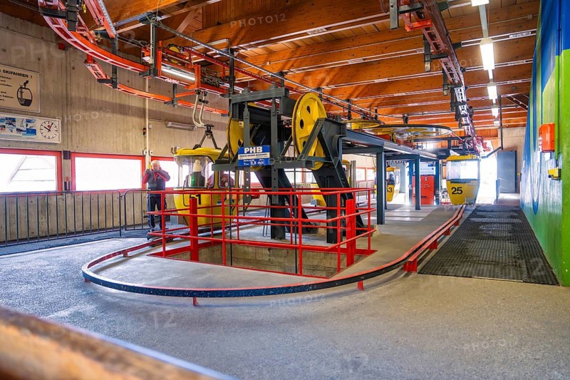 Interior view of a cable car station with yellow cabin and colorful walls, Hochgrat Mountains, Allgäu Alps, Oberreute, Germany