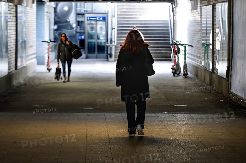 Women walk through a dark tunnel at Berlin Friedenau S-Bahn station, 06.03.2026, Berlin, Berlin, Germany