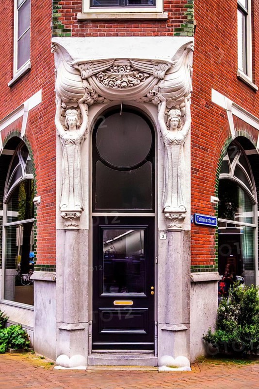 Entrance of the building at Tolhuisstraat 2 in the Katendrecht district, remarkable example of Art Nouveau architecture, city panorama, Rotterdam, the Netherlands