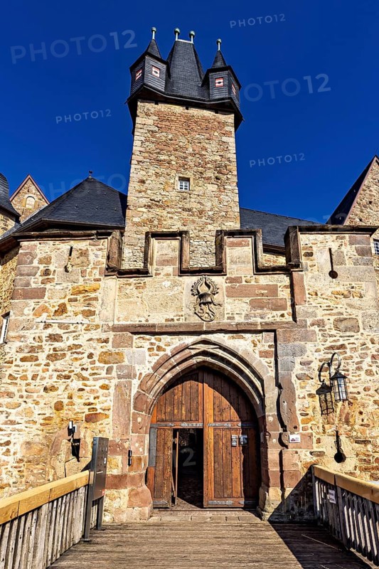 View of the entrance gate to a historic castle with rustic stone elements, Spangenberg Castle