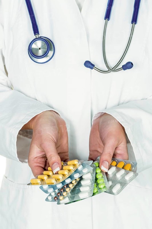 A doctor shows various packs of tablets, tablet addiction, medication addiction Studio shot, Federal Republic of Germany