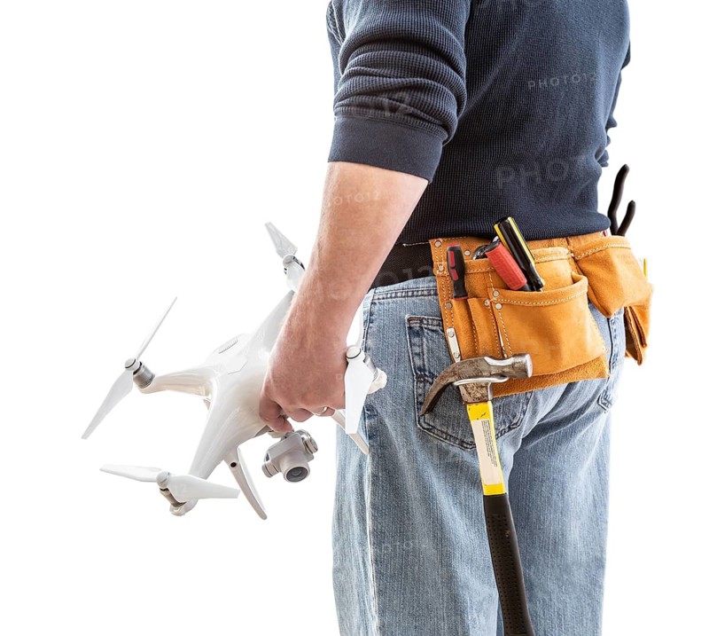 Construction Worker and Drone Pilot With Toolbelt Holding Drone Isolated on White Background