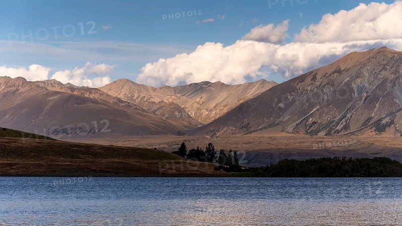 Landscape with lake and mountains in the evening light. Lake McGregor, Tekapo, Canterbury, South Island, New Zealand