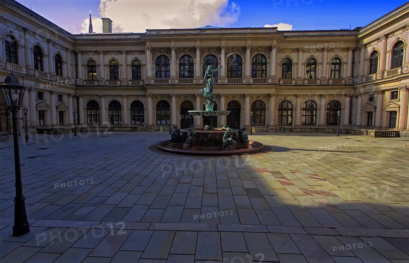 Courtyard of Hamburg City Hall with Hygieia fountain in the center and historic architecture all around, Hamburg, Germany
