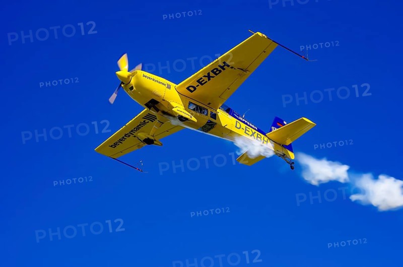 An Extra EA-300 from Extra Flugzeugproduktions- und Vertriebs GmbH with registration D-EXBH during a flight demonstration as part of an air show on Rossfeld in Metzingen-Glems, Baden-Württemberg, Germany, for editorial use only