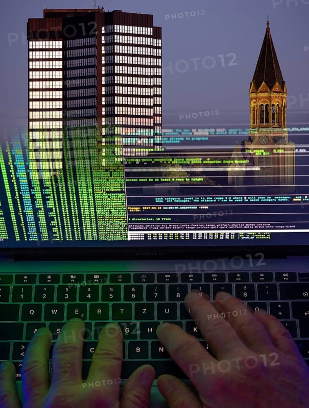 Symbolic image hacker, cyber attack on public buildings, administrations, institutions, town hall, authorities, digital blackmail, data theft, online criminal offences, cyber extortion, ransomware
