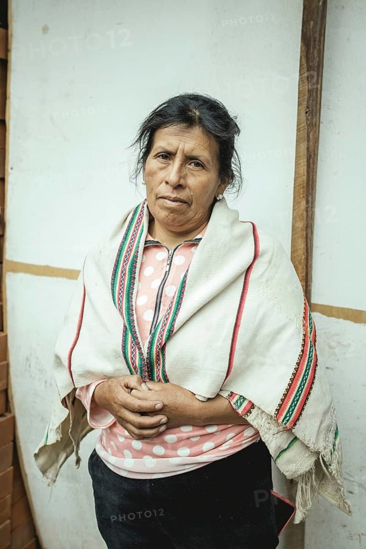 Portrait of a miner in her home, Cachapalca, Peru