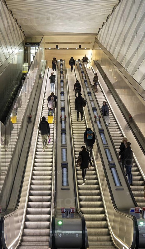 People on escalator Elizabeth Line, Liverpool Street underground railway station, London, England, UK
