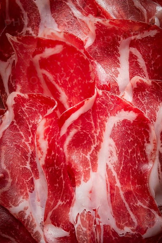 Sliced cured ham, prosciutto, italian dish, delicacy, parma ham, top view, no people