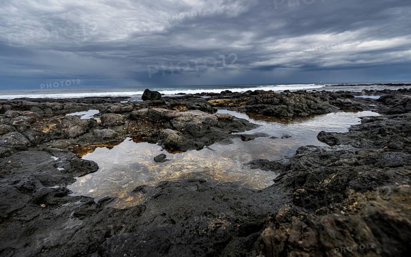 Tide pools, rocky coast with volcanic stones, Playa de la Pequeña, Punta Usaje, Lanzarote, Canary Islands, Spain