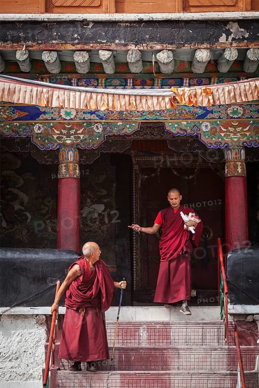 SPITUK, INDIA, SEPTEMBER 6, 2011: Tibetan Buddhist monks ascending the stairs in Spituk monastery. Ladakh, India