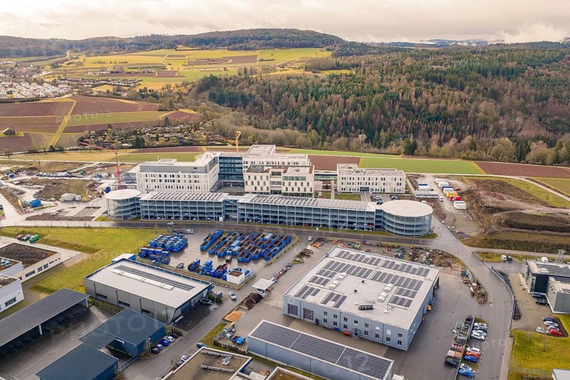 Large industrial area with modern buildings in rural surroundings, shortly in front of opening, Calw Health Campus, Calw district, Germany