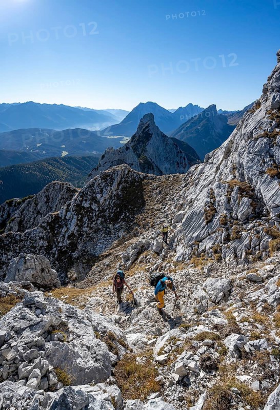 Mountaineers on a hiking trail, autumnal mountain landscape, ascent to the Große Arnspitze, Arnplattenspitz at the back, near Scharnitz, Bavaria, Germany
