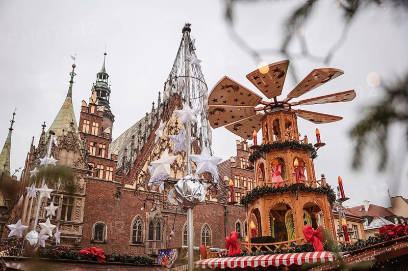 Christmas fair in the market square of Wroclaw, Poland. The city hall and wind mill