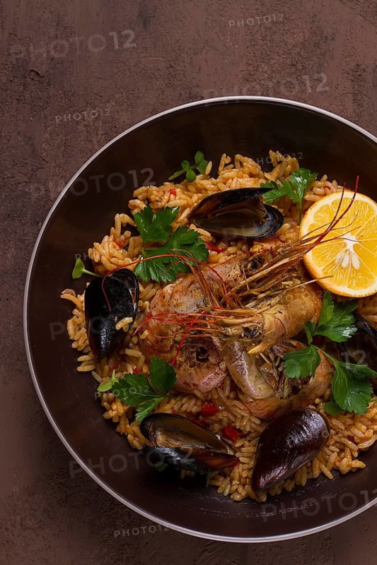 Seafood paella, shrimp and mussels risotto, rice, homemade, top view, no people