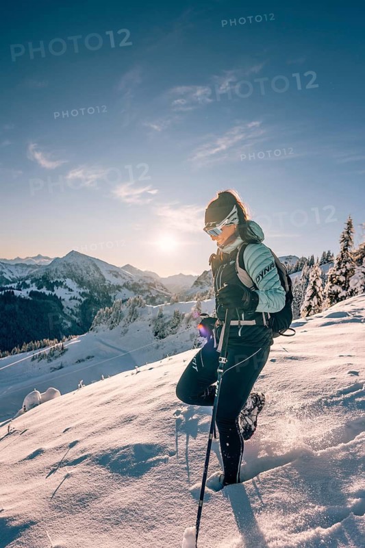 Hiking in the snow in the snow-covered winder landscape in the Alps at Neunerköpfle in the Tannheimer Tal in Tyrol, Austria