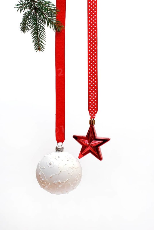 Christmas baubles and star on a red ribbon, Christmas decorations