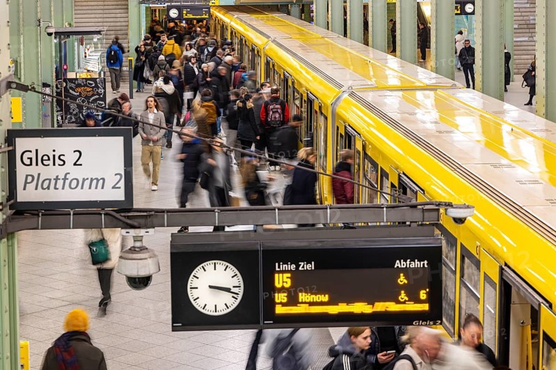 Alexanderplatz railway station in Berlin. Railway platform with people and subway. Berlin, Germany