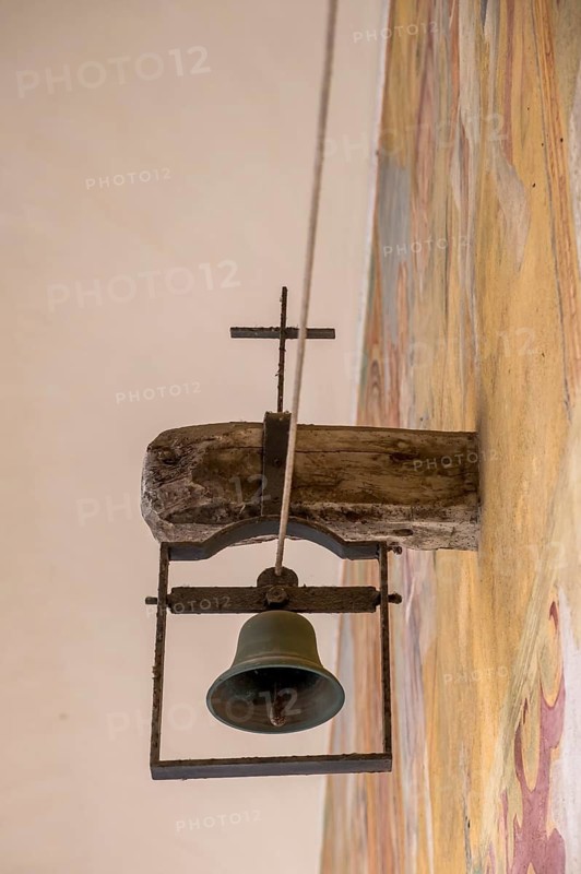 Bell in the cloister of the Basilica of Santa Caterina d'Alessandria, Franciscan church, Galatina, Province of Lecce, Apulia, Italy