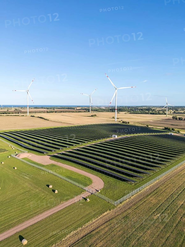 Wind farm and solar cells renewable energy wind power wind energy on the Baltic Sea aerial view near Heiligenhafen, Germany