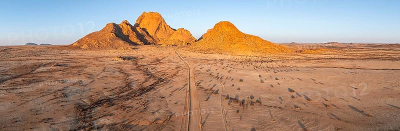 Aerial view, sunset, mountains in the desert, Spitzkoppe summit, Namib desert, Namibia