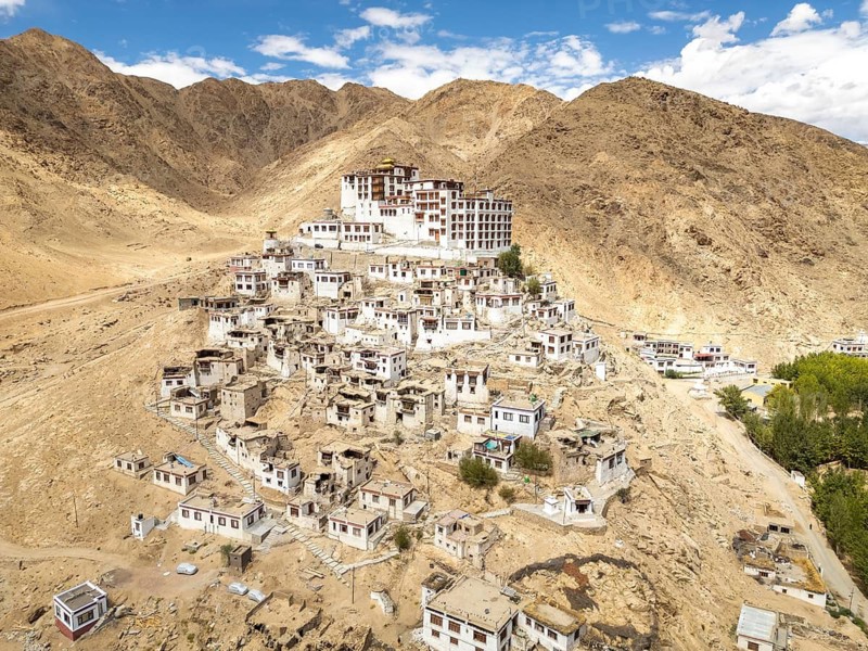 View of Chemrey Gompa, a picturesque monastery in Ladakh, India, nestled among the rugged mountains of the Himalayas, showcasing ancient Buddhist architecture and serene landscapes