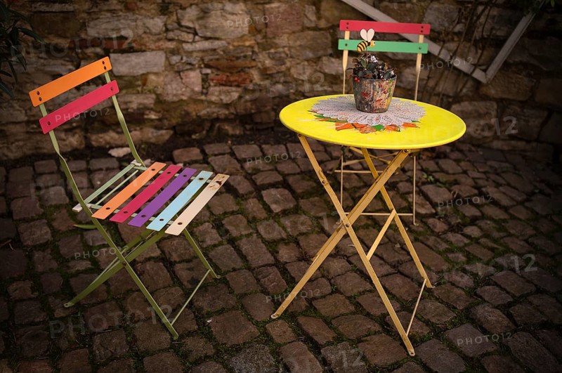Colored chair, folding chair, flower pot on table, idyllic, Bad Wimpfen, Kraichgau, Baden-Württemberg, Germany