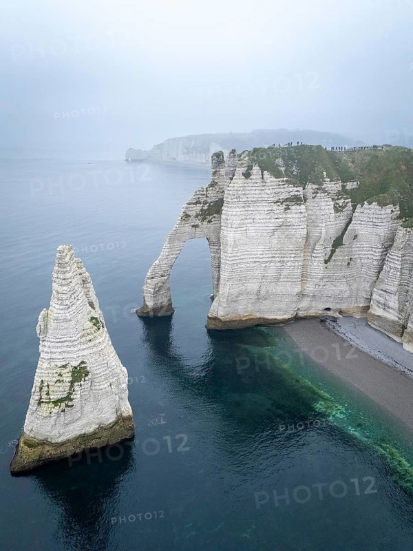 Aerial view of La Porte d'Aval and l'Aiguille on the Alabaster Coast in light fog, Etretat, Normandy, France